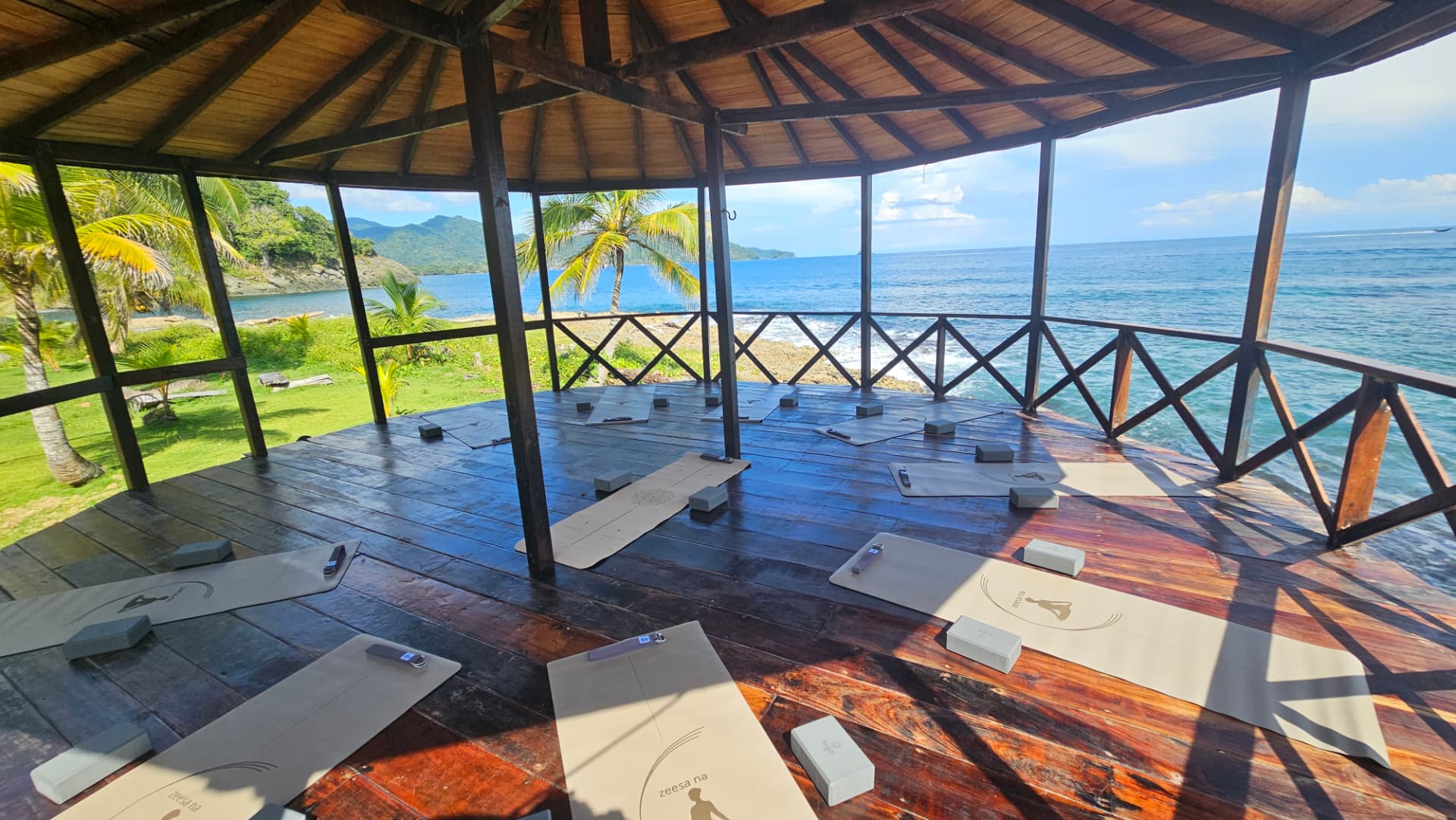 Yoga deck with mats overlooking the Caribbean Sea